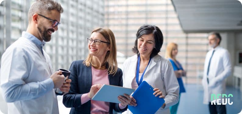 A sales rep showing a customer a plan on a clipboard. 