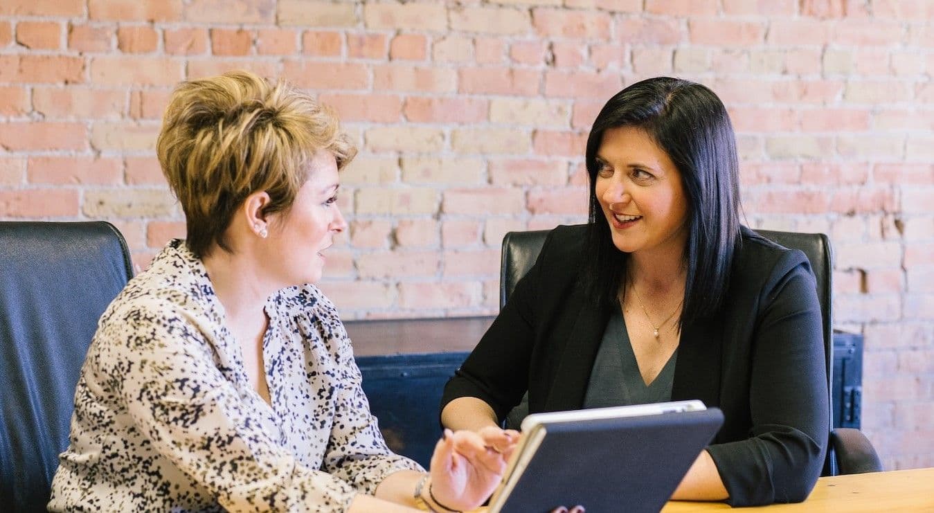 Interview being conducted between two women