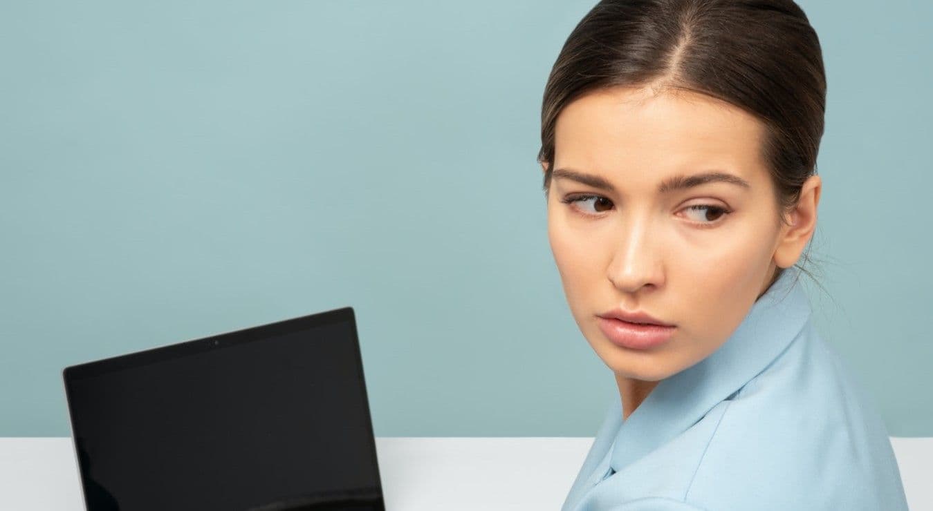 Woman looking over shoulder with concern