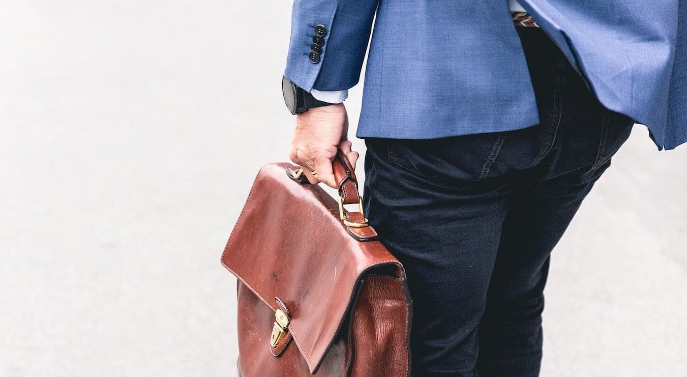Man walking with book bag