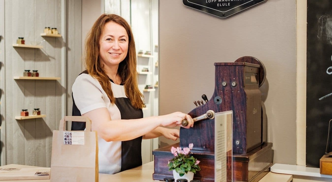 Woman cashier and owner small business