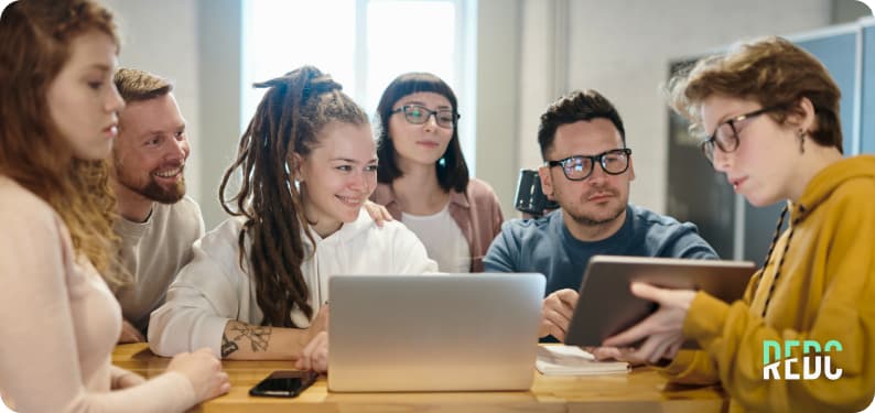 A group of people working together on laptops.
