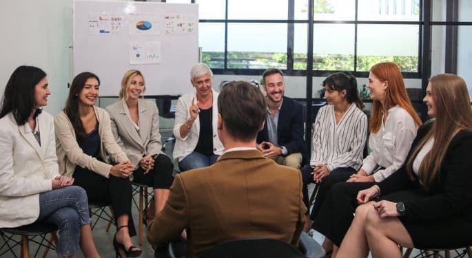A small group meeting in the workplace.