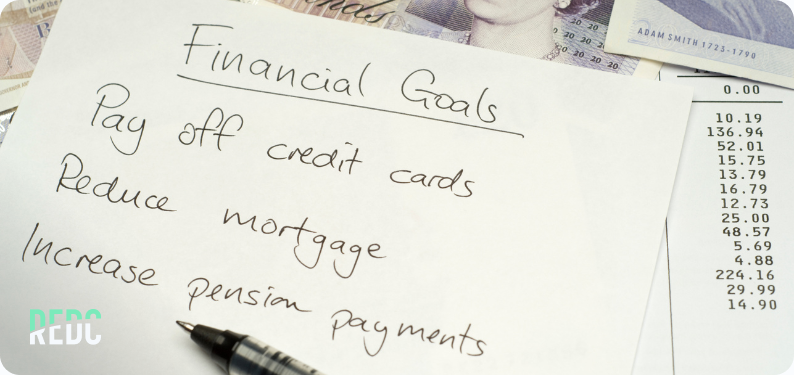 A handwritten list of financial goals.